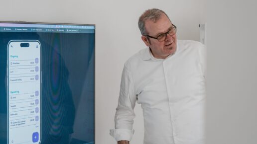 Vetica expert presenting a digital app concept on a large screen.